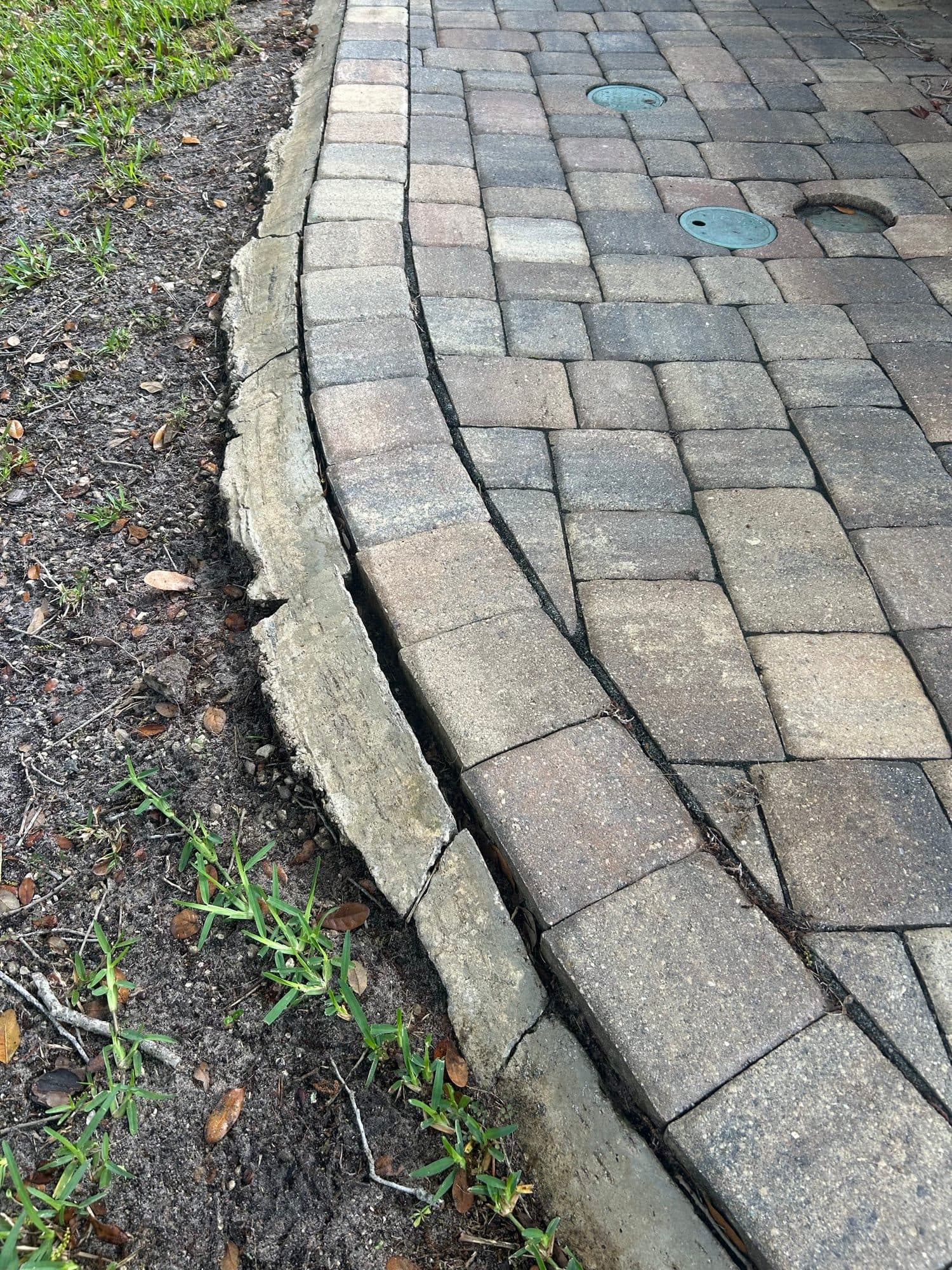 Exposed paver base with mortar haunch — paver work by Atlantic Exteriors in Brevard County, FL