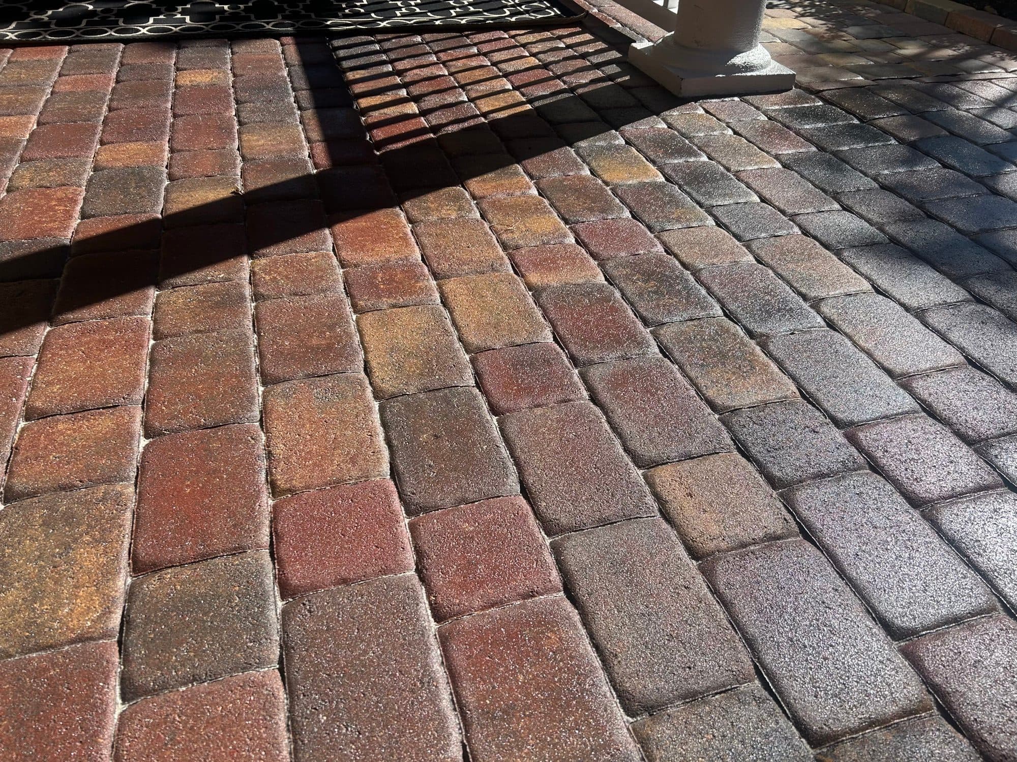 Tumbled paver entry, richly sealed — paver work by Atlantic Exteriors in Brevard County, FL