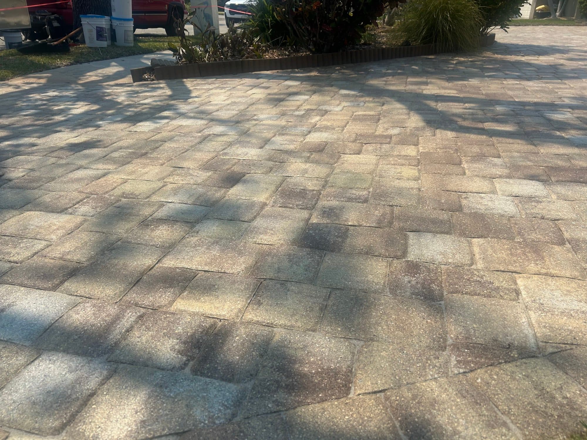 Sealed driveway in afternoon shade — paver work by Atlantic Exteriors in Brevard County, FL