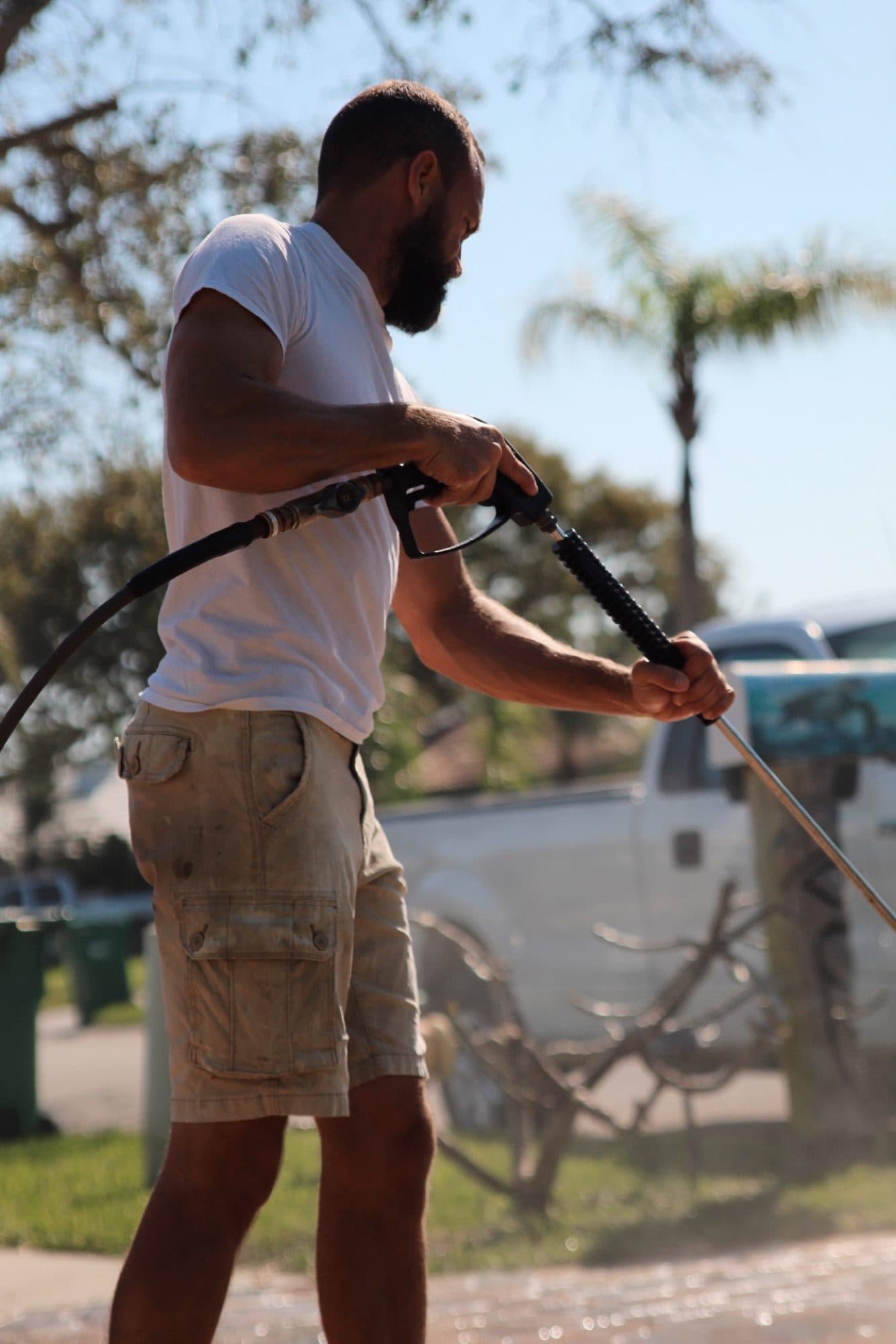 Derek with the pressure-wash wand — paver work by Atlantic Exteriors in Brevard County, FL
