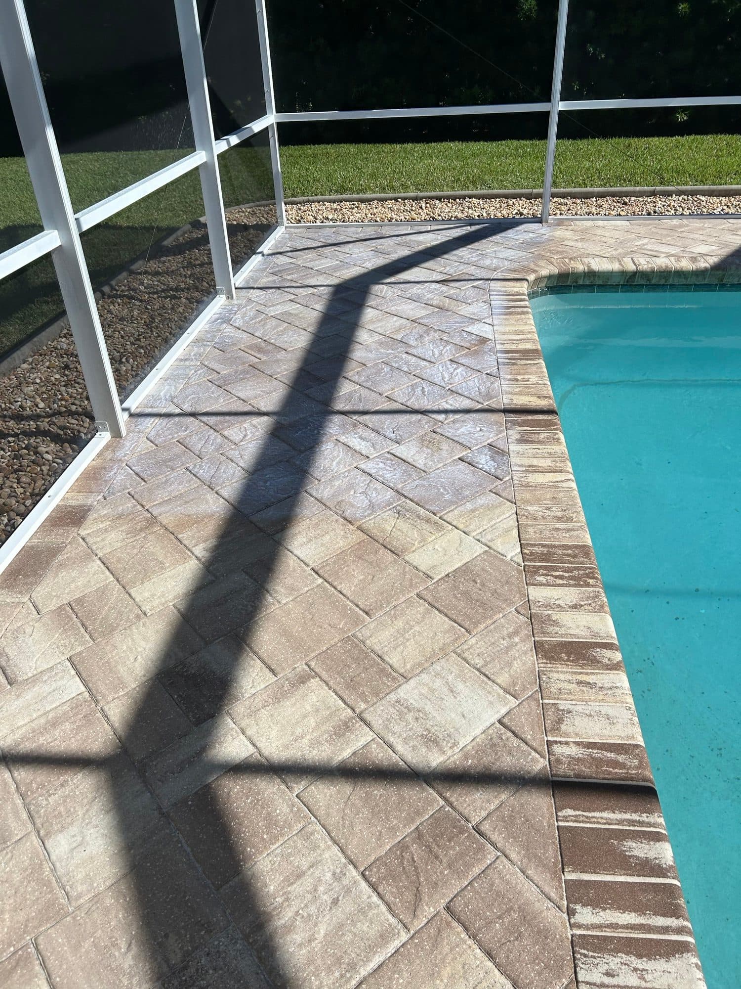 Pool coping with herringbone deck — paver work by Atlantic Exteriors in Brevard County, FL