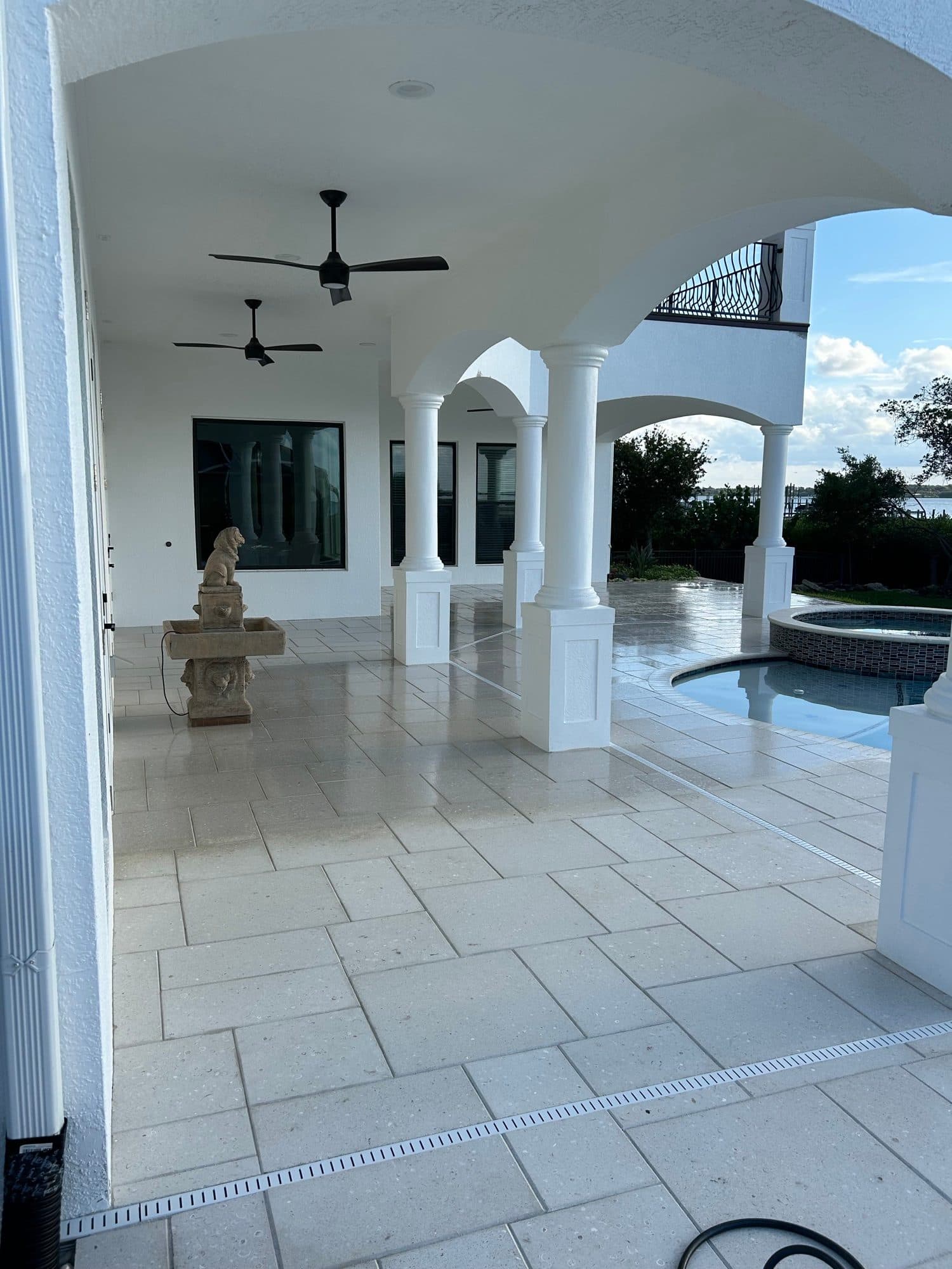 Travertine pool lanai with arches — paver work by Atlantic Exteriors in Brevard County, FL