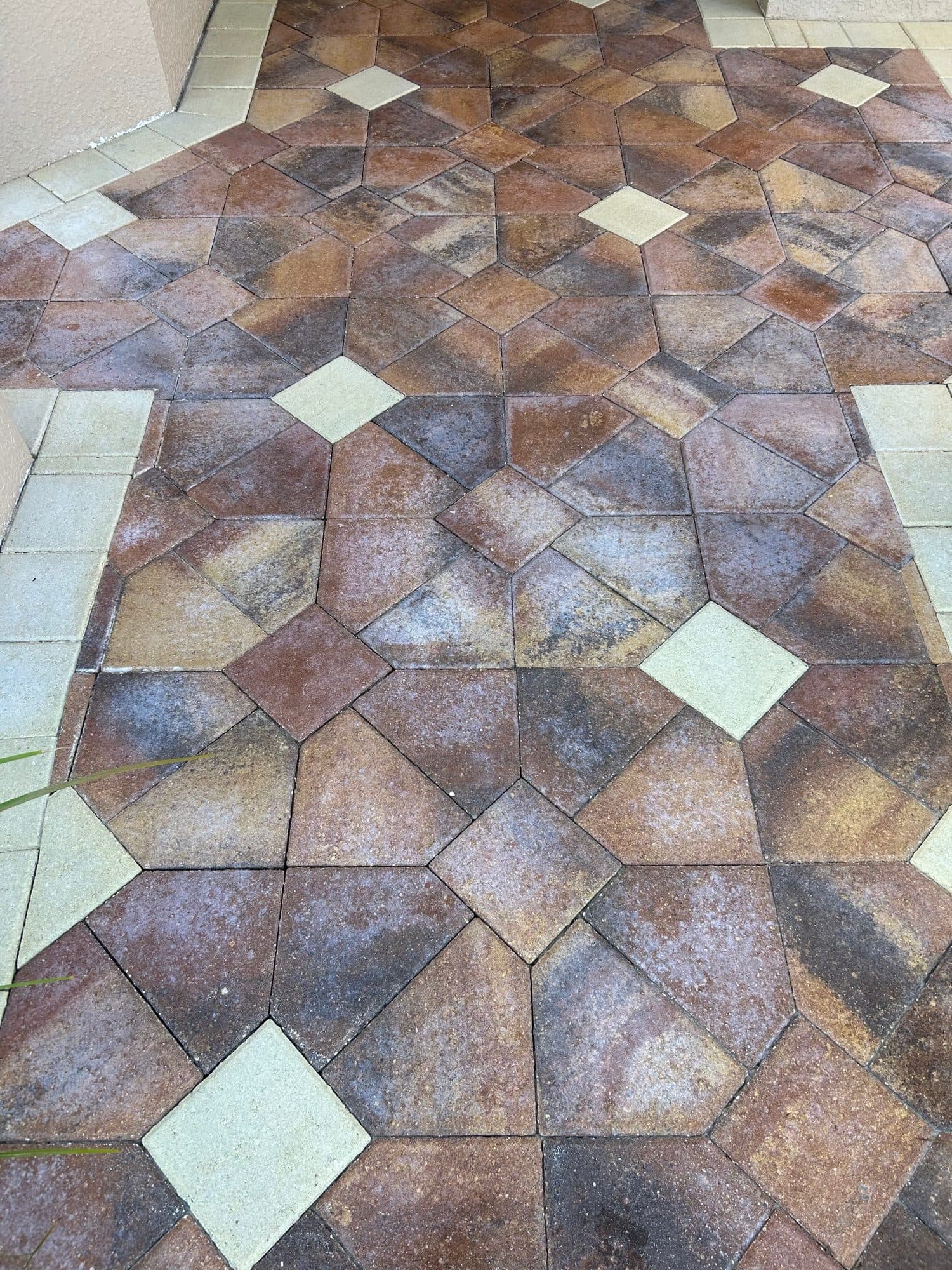 Close-up geometric walkway with accents — paver work by Atlantic Exteriors in Brevard County, FL