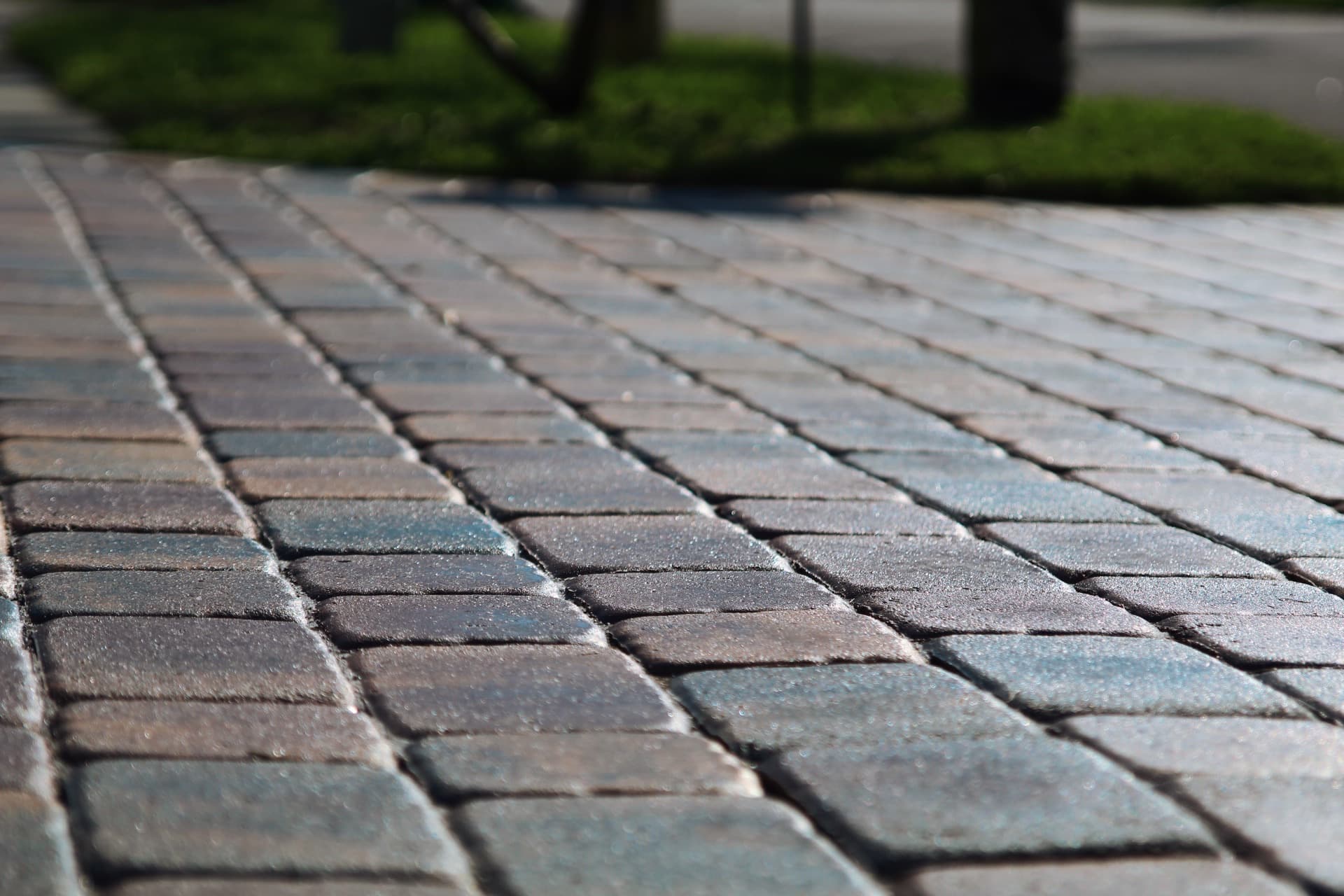 Tumbled paver detail, sealed rich and even — paver work by Atlantic Exteriors in Brevard County, FL